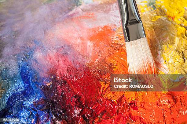 Paintbrush With Red Oil Paint On A Classical Palette Stock Photo - Download Image Now