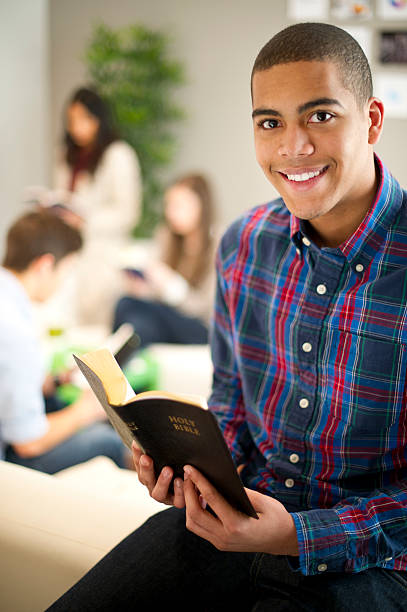 istock teenage bible class man 185077040