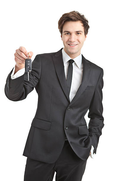 istock young handsome businessman with car keys 185077090