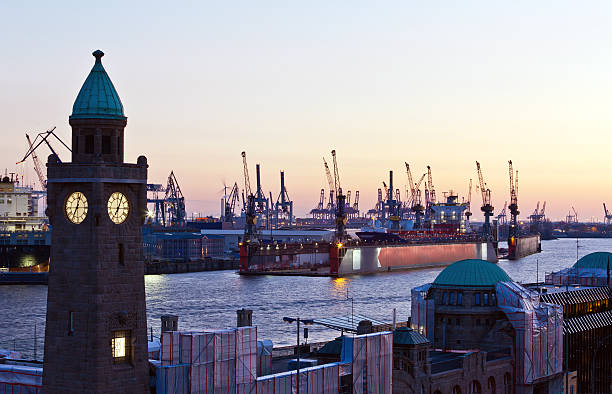 istock Hamburg harbour in the evening, Shipyards and cranes. 185077096