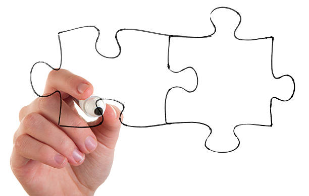 istock Woman drawing a jigsaw connection concept 185077499