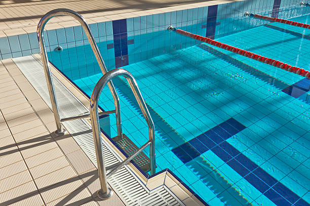 Swimming Pool with stair Olympic Swimming Pool with stairSee more WATER PARKS and SWIMMING POOLS images here: swimming pool lane ropes stock pictures, royalty-free photos & images
