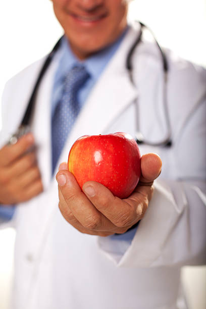 istock Doctor showing you an Apple 185077761