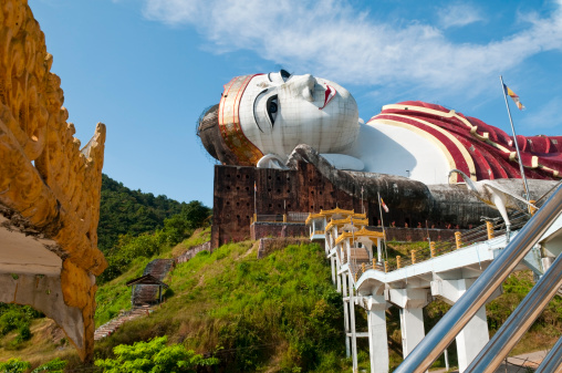 Reclining Buddha statue at Win Sein Taw Ya, located about 12 miles south of Mawlamyine, Myanmar (Burma) The Buddha statue is 170 meters in length and 30 meters in height, making it one of the largest reclining Buddhas in the world.