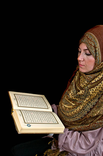 istock Muslim Woman Reading the Koran 185078128