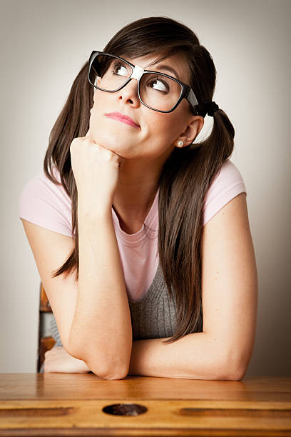 istock Bored, Nerdy, Young Woman Student Sitting at School Desk 185078587