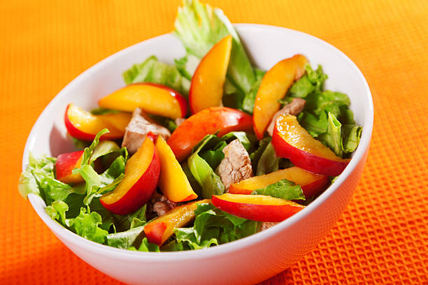 Chicken salad with peaches stock photo
