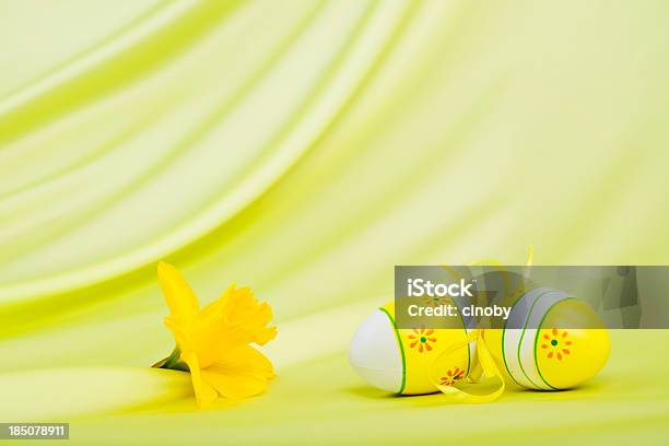 Yellow Easter Eggs And Daffodils Bloom Stock Photo - Download Image Now - Animal Egg, Animal Markings, Arrangement