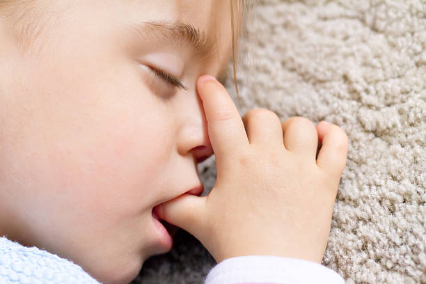 istock Toddler asleep and sucking thumb 185079273