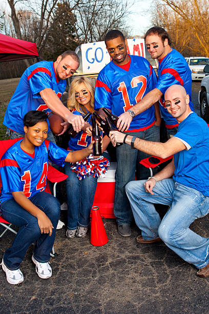 istock Happy football fans tailgating 185079437