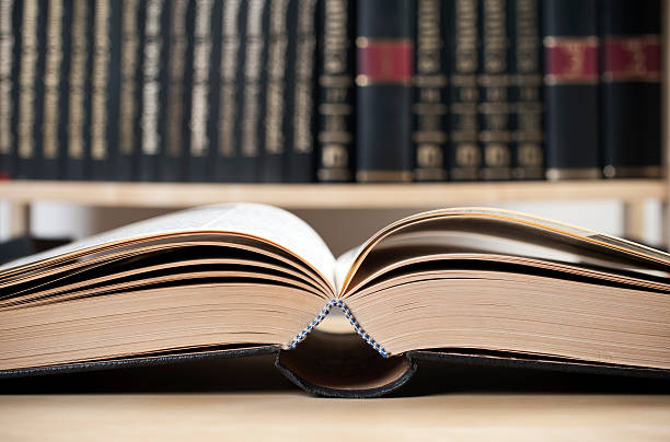 open old book open old book on the table in the library encyclopaedia stock pictures, royalty-free photos & images