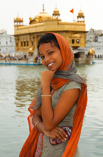 Pilgrim girl in Golden Temple Amritsar, India stock photo