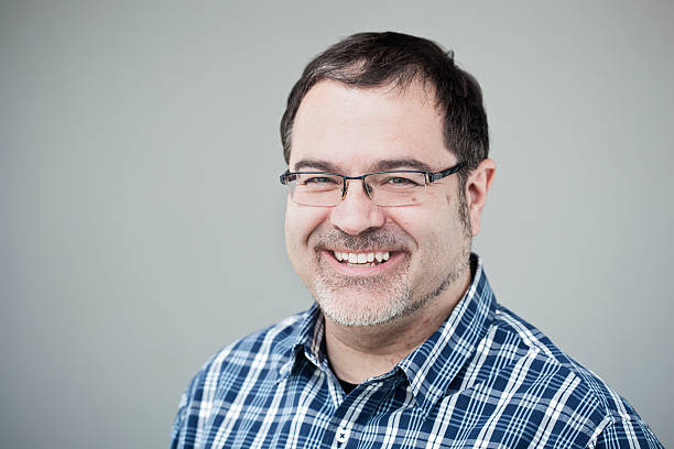 istock Middle aged man smiling head and shoulders portrait. 185080242