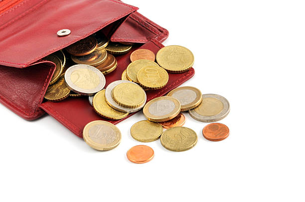 istock Euro coin falling out of wallet 185080277