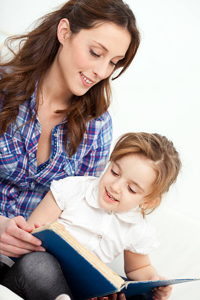 istock Mother and daughter reading book. 185080702