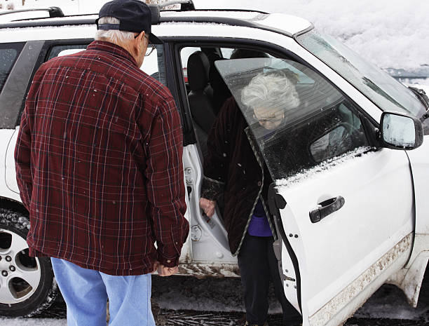 istock Senior Couple Getting Into Winter Car 185081920
