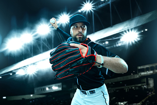 Baseball player on stadium. Game day. Download a high resolution photo to advertise baseball games in sports betting.