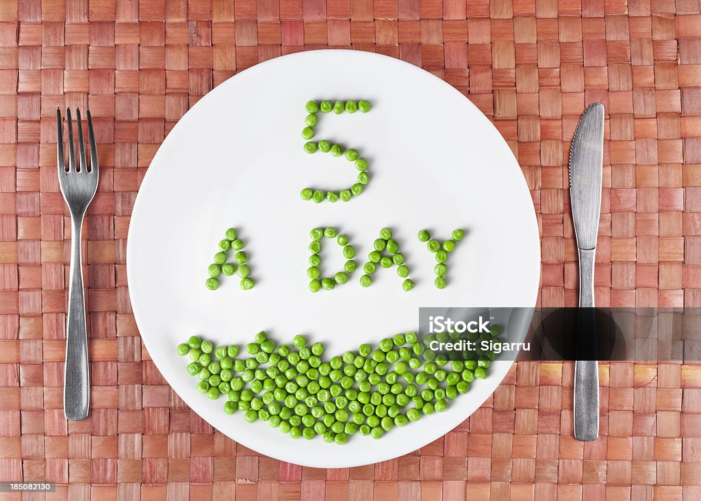 Five a day 5 a day written with peas on a plate Fruit Stock Photo