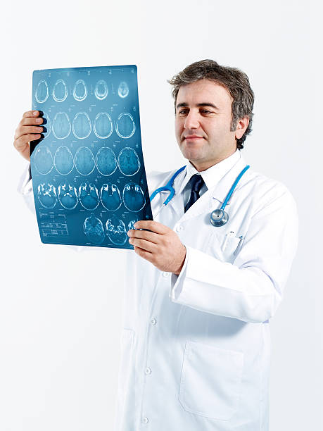 istock Medical doctor analyzing a CT scan 185082869