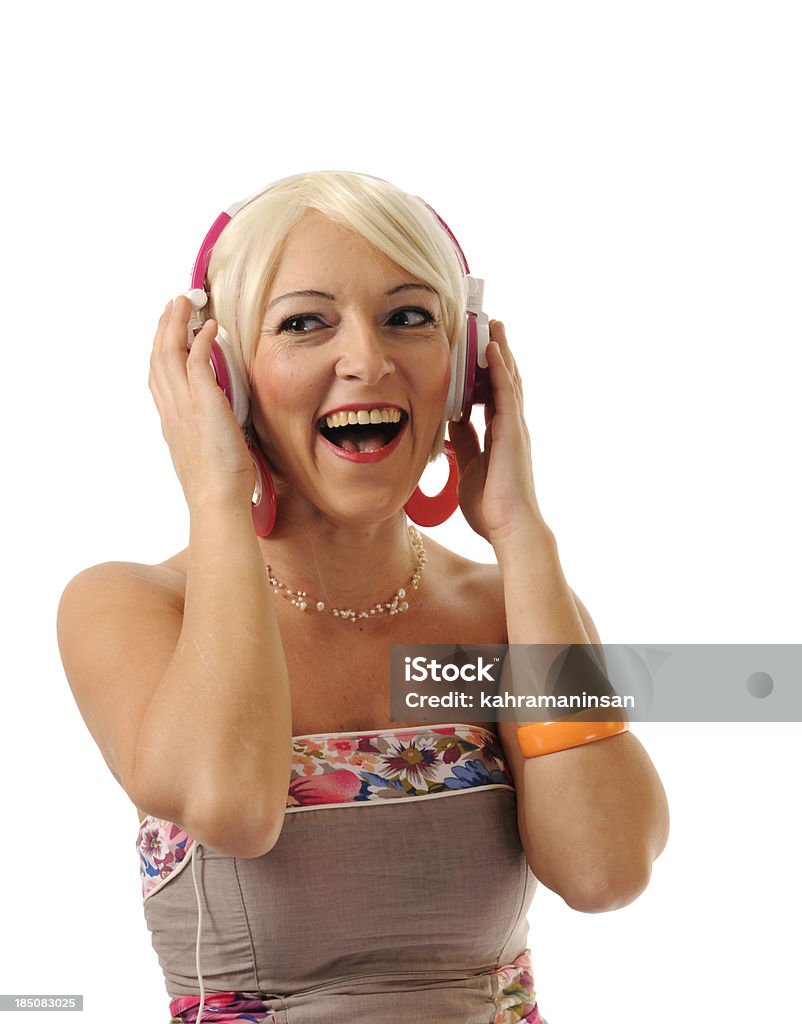 Happy blond woman enjoying the music Isolated on white backgound. 20-29 Years Stock Photo