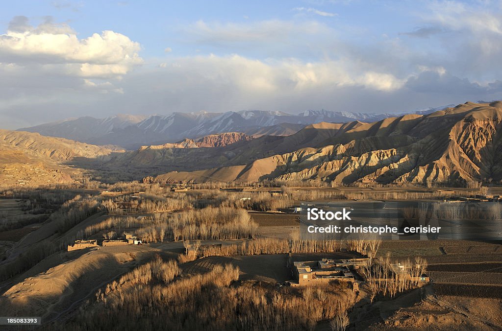 Bamyan at dusk "Bamyan farmhouses and mountains at dusk, Afghanistan" Mountain Stock Photo