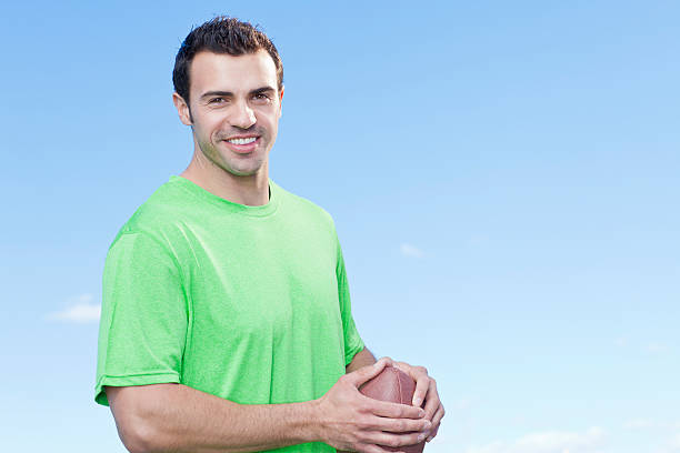istock Athletic man with football 185083938