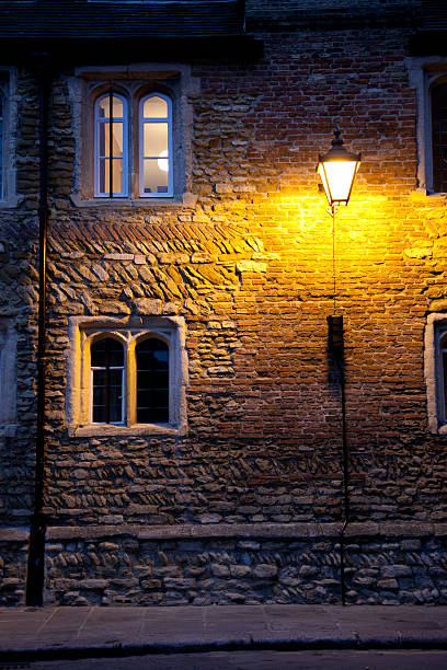 istock Cambridge University building at night 185083939