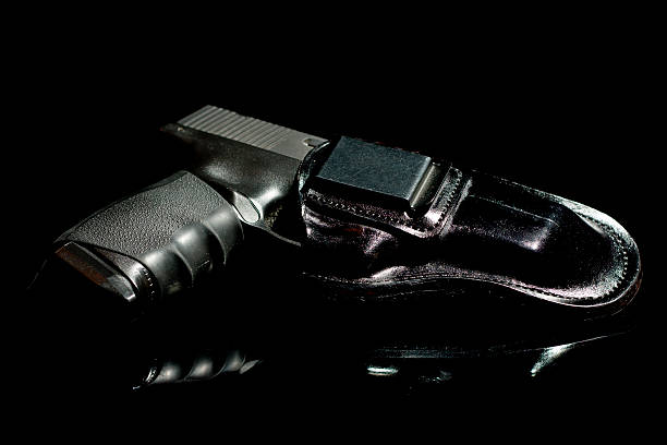 istock Modern Polymer Pistol in an Inside-the-Waistband Holster 185084432