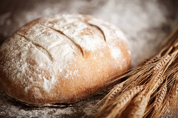 Irish Soda Bread Irish soda bread & dry wheat stalks. Wheat Bread stock pictures, royalty-free photos & images