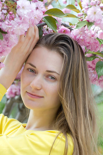 istock Spring portrait beautiful woman with sakura tree 185084527