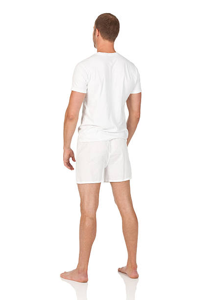 vue arrière d'un homme debout - underwear men t shirt white photos et images de collection