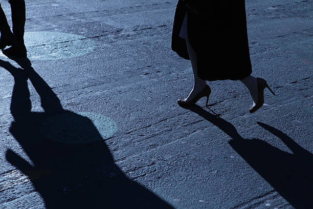 istock Lone female walking in blue night shadows 185085179