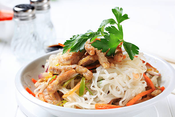 istock Rice noodles, meat and vegetables 185085362