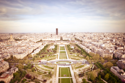 Aerial view of Champ de Mars park taken from the eiffel tower using a tilt shift lens for selective focus.
