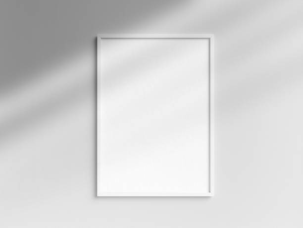 istock Blank white photo frame template hanging on the wall 1850863823