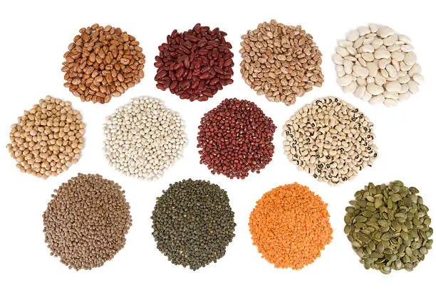 Overhead view of different varieties of healthy beans,lentils and seeds.