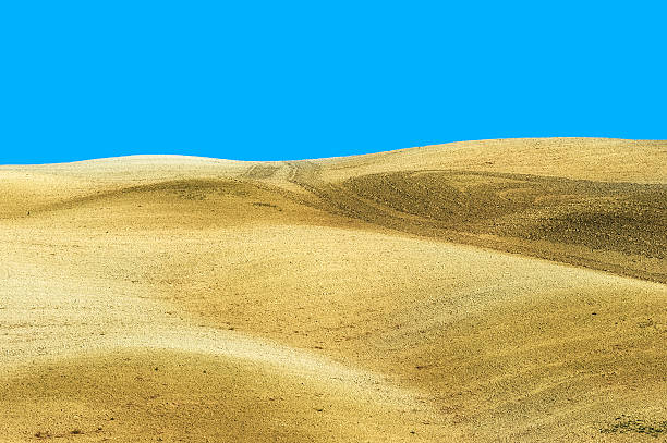 istock Crete Field Against Blue Sky in Val D'Orcia, Tuscany 185086688