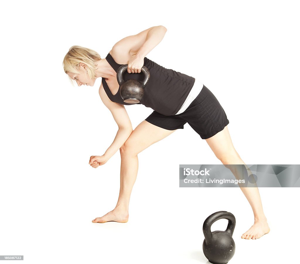 Kettlebells Attractive woman doing kettlebells fitness. White Background Stock Photo