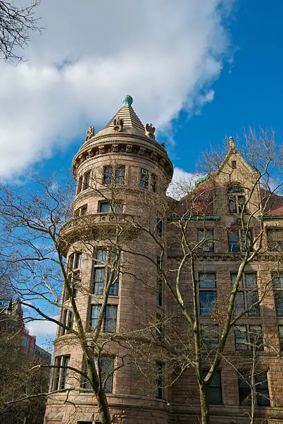 "A cityscape view of the Romanesque Revival style corner tower of the American Museum of Natural History, located at W.77th Street and Central Park West in Manhattan, New York City. The tower is 150 ft (46m) high and is part of a 700 ft (210 m) complex along West 77th Street that was built in the 1880's. Upper West Side of Manhattan, New York City."