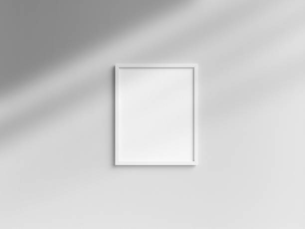 istock Blank 8x10 white photo frame template hanging on the wall 1850873190