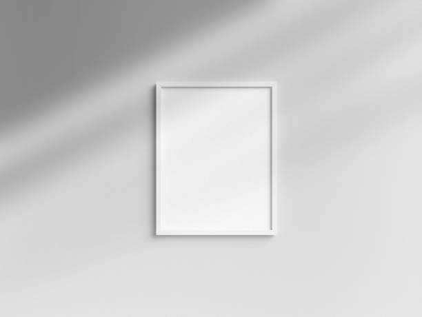 istock Blank Letter size white photo frame template hanging on the wall 1850873705