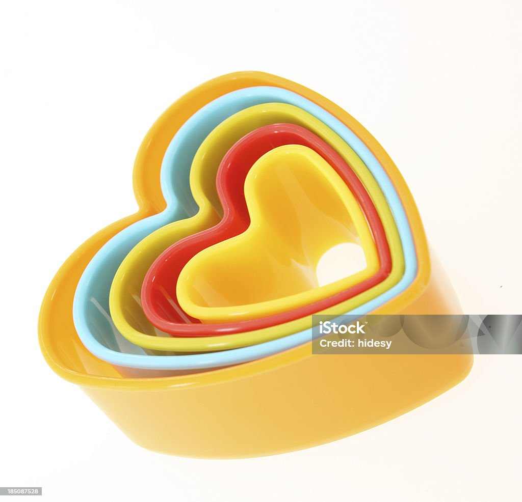 Símbolo en forma de corazón con pedacitos de alicates de corte - Foto de stock de Cortador de masa libre de derechos