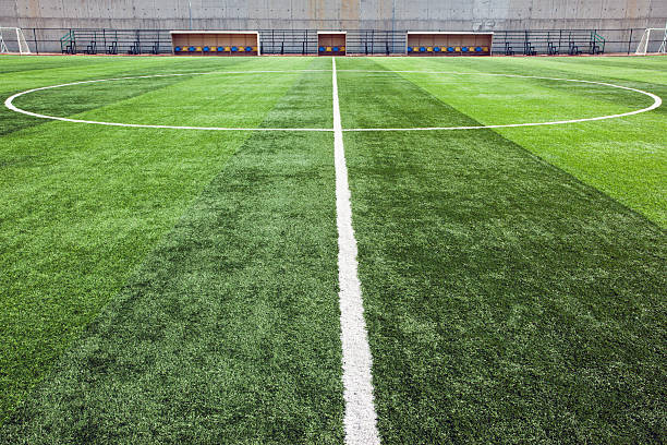 Close-up of the center line of soccer field stock photo