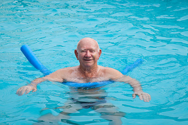 istock Healthy active senior man in swimming pool blue water copyspace 185087757