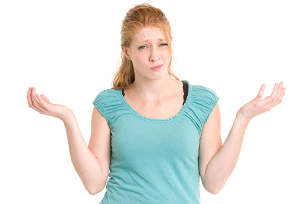 istock Confused Shrugging Young Woman 185087900