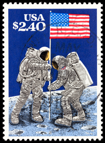 Cancelled Stamp From The United States: Astronaut on the Moon with American Flag.