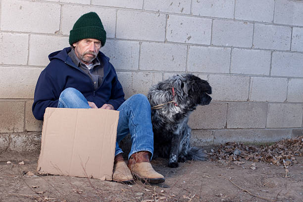 istock Homeless Man Holding Sign 185088148