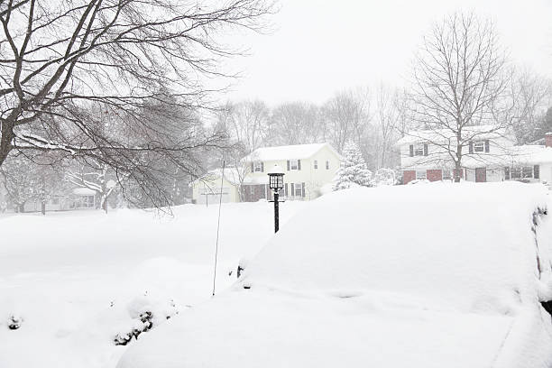 istock Blizzard Snow Covered Car in Driveway 185088236