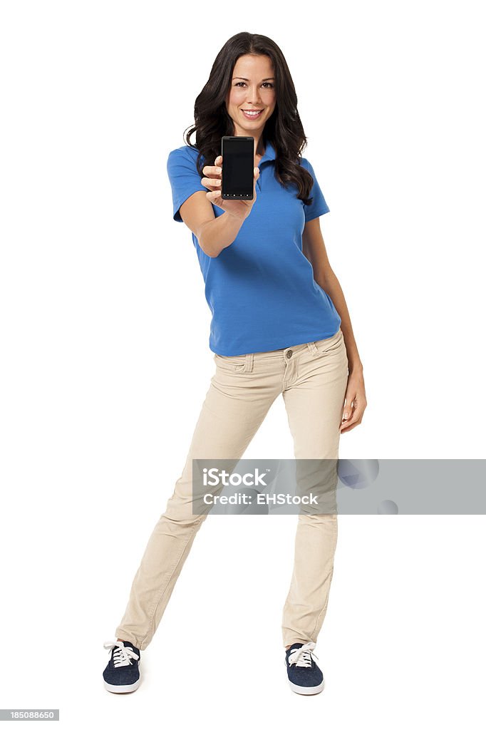Młoda kobieta ubrana na sportowo z Smartphone na białym tle - Zbiór zdjęć royalty-free (Białe tło)