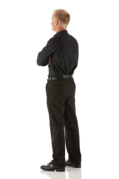 istock Profile of a man standing with his arms crossed 185089269